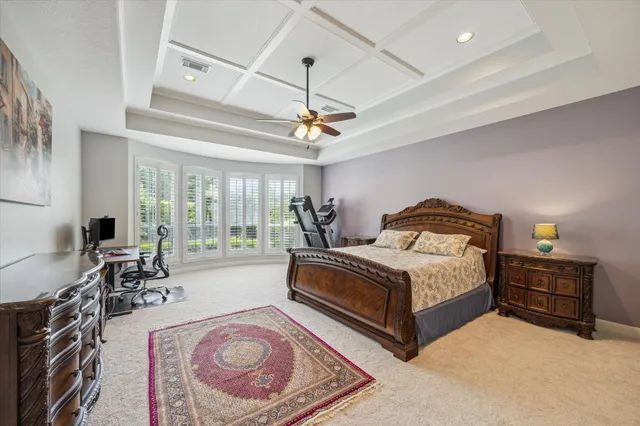 a spacious bedroom with a bed and window