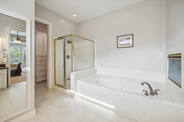 a bathroom with a bathtub and a shower