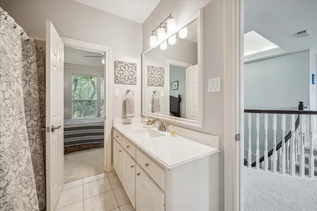 a bathroom with a sink a mirror and a shower