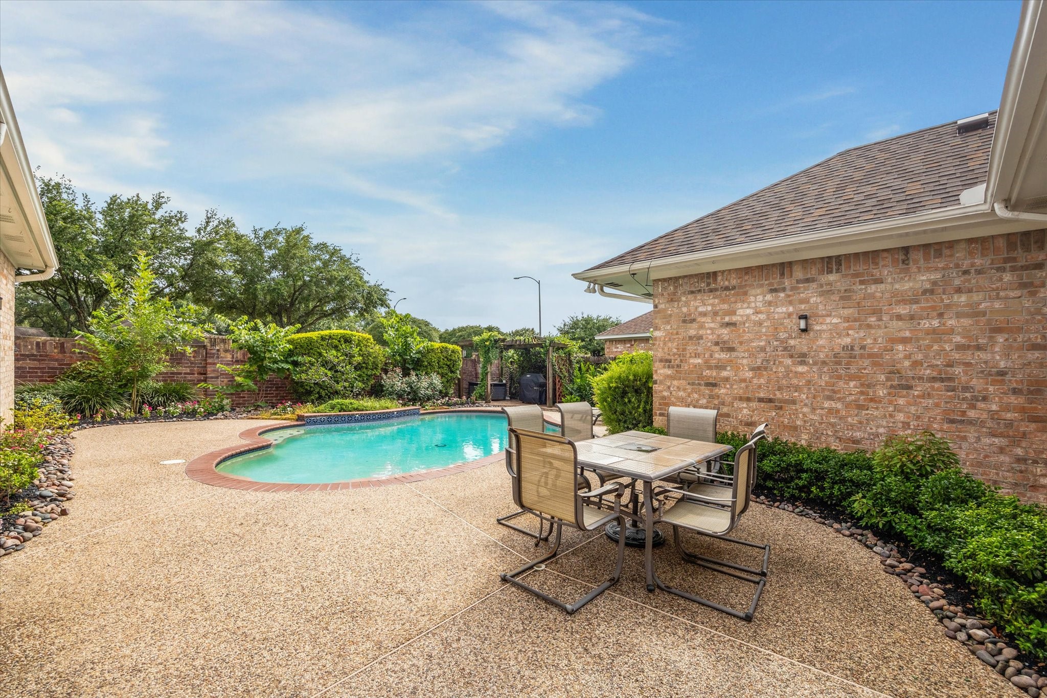 13627 Ashley Run Houston, TX 77077 - Photo 26 of 28 a view of backyard with outdoor seating and plants