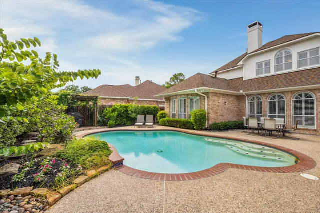 front view of a house with a swimming pool