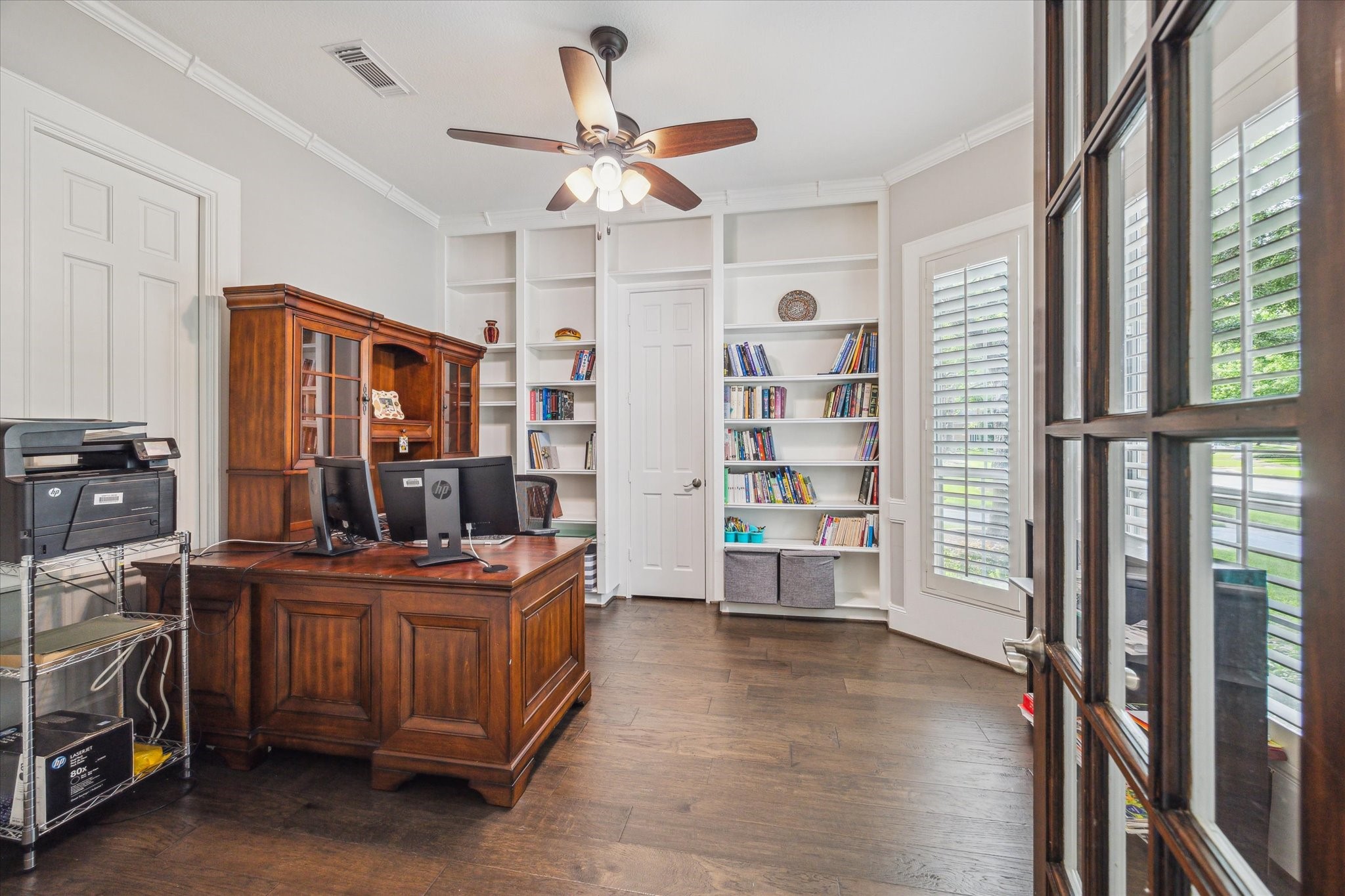 13627 Ashley Run Houston, TX 77077 - Photo 4 of 28 a view of a room with workspace and windows