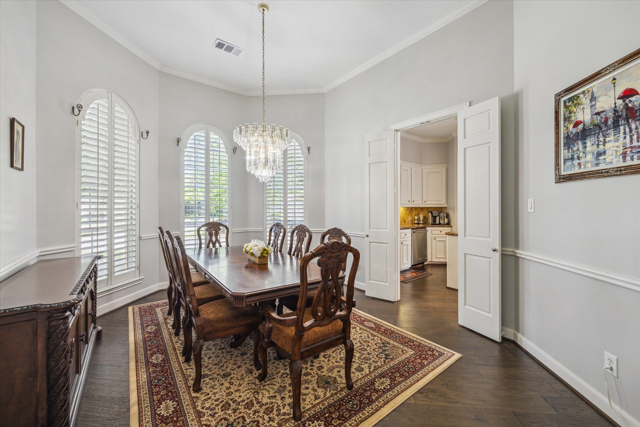 13627 Ashley Run Houston, TX 77077 - Photo 5 of 28 a dining room with furniture a chandelier and wooden floor