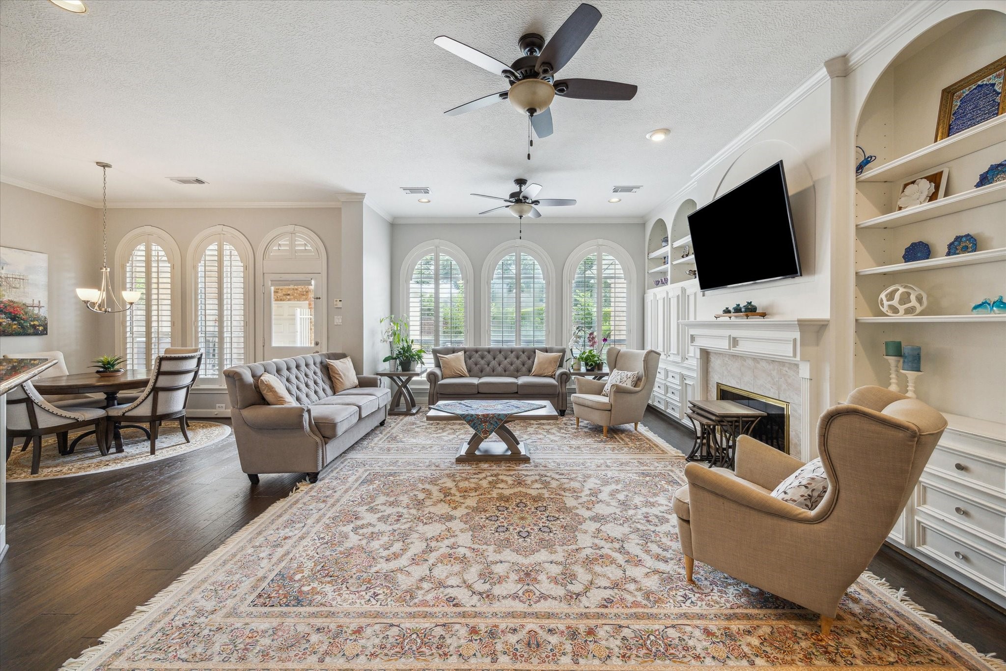 13627 Ashley Run Houston, TX 77077 - Photo 7 of 28 a living room with fireplace furniture and a flat screen tv