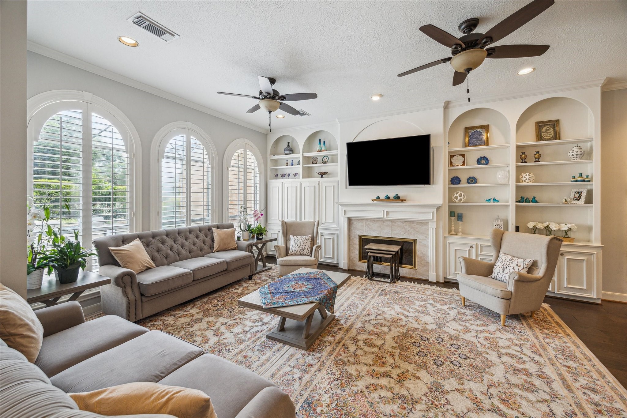 13627 Ashley Run Houston, TX 77077 - Photo 8 of 28 a living room with furniture a fireplace and a flat screen tv