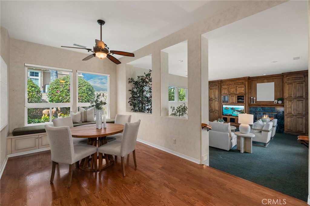 5501 Carriage Place Rancho Cucamonga, CA 91737 - Photo 19 of 60 a view of a livingroom with furniture window and wooden floor