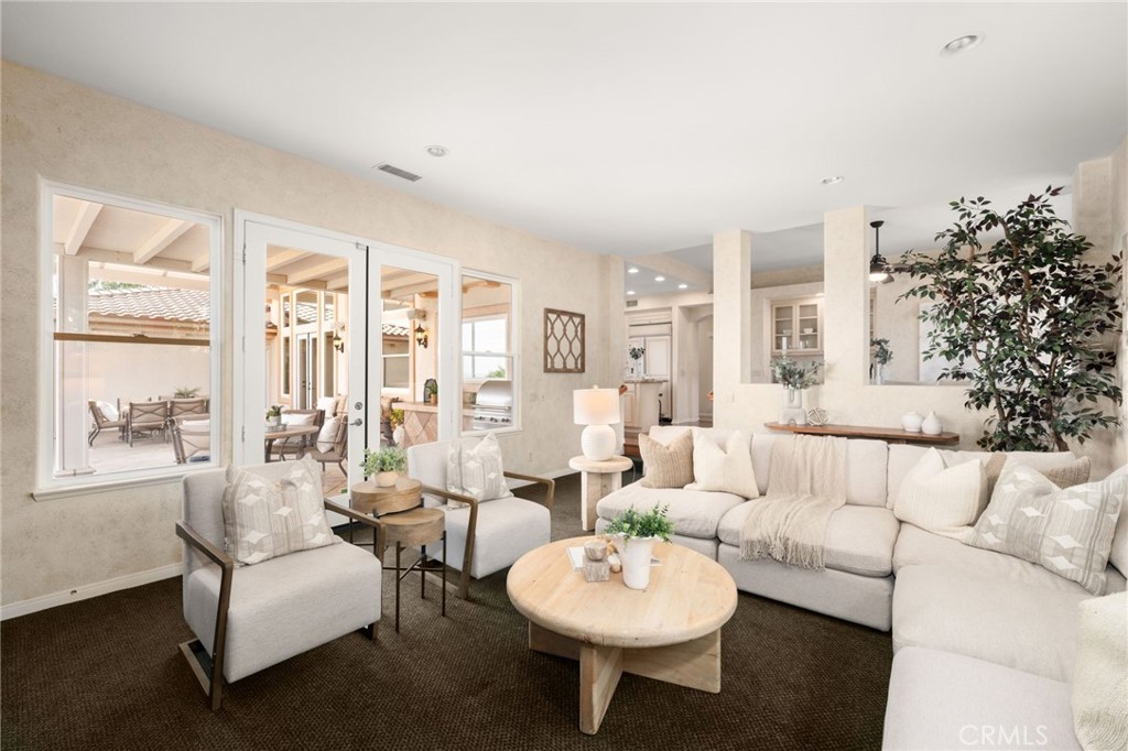 5501 Carriage Place Rancho Cucamonga, CA 91737 - Photo 21 of 60 a living room with furniture and a large window