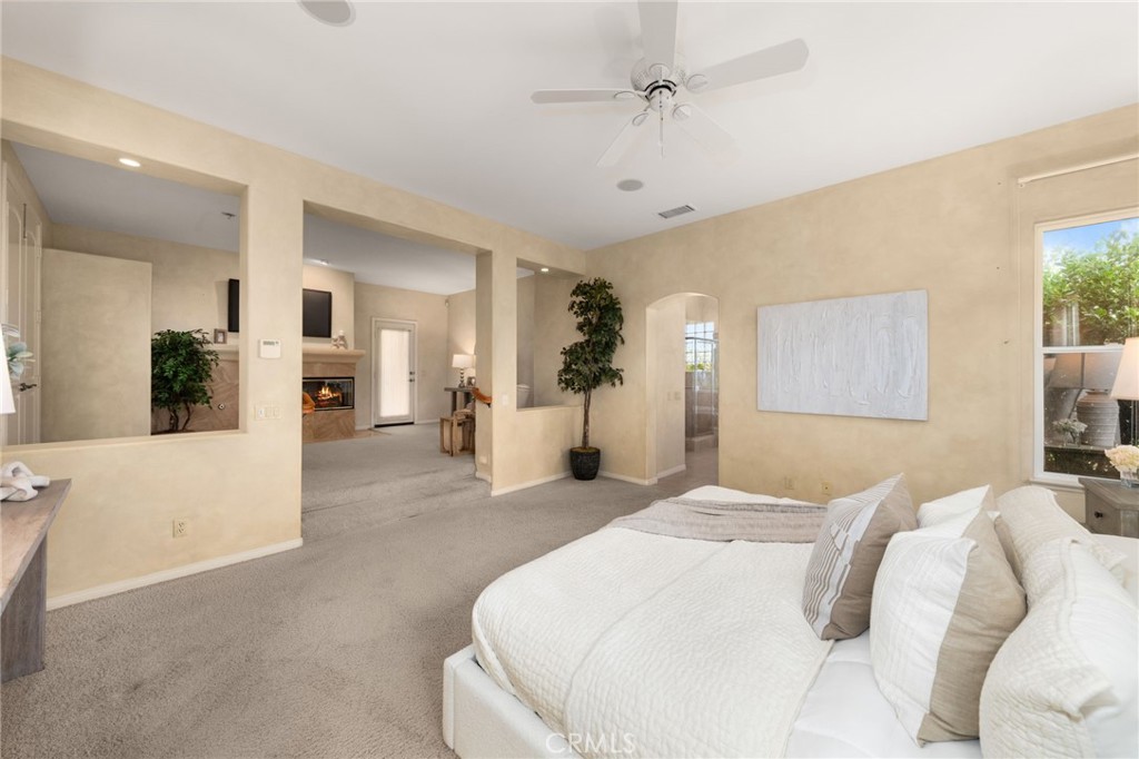 5501 Carriage Place Rancho Cucamonga, CA 91737 - Photo 24 of 60 a large white bed in a white room