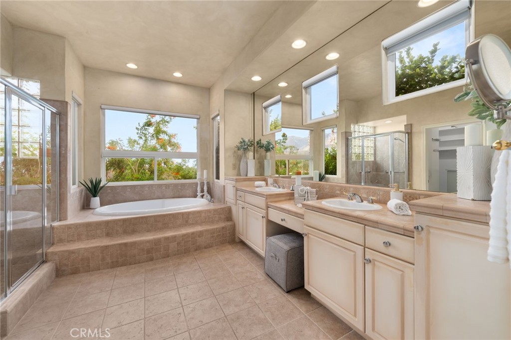 5501 Carriage Place Rancho Cucamonga, CA 91737 - Photo 27 of 60 a bathroom with a sink vanity and mirror