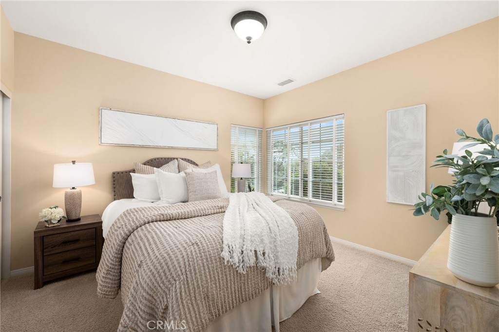 5501 Carriage Place Rancho Cucamonga, CA 91737 - Photo 31 of 60 a bed sitting in a bedroom next to a window