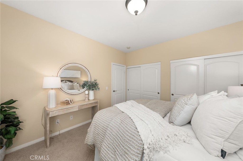 5501 Carriage Place Rancho Cucamonga, CA 91737 - Photo 32 of 60 a bedroom with a bed and window