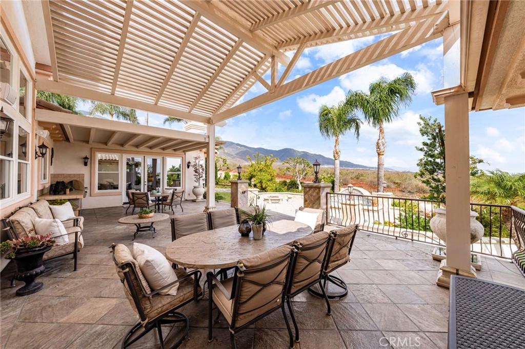5501 Carriage Place Rancho Cucamonga, CA 91737 - Photo 41 of 60 a dining room with furniture and a potted plant