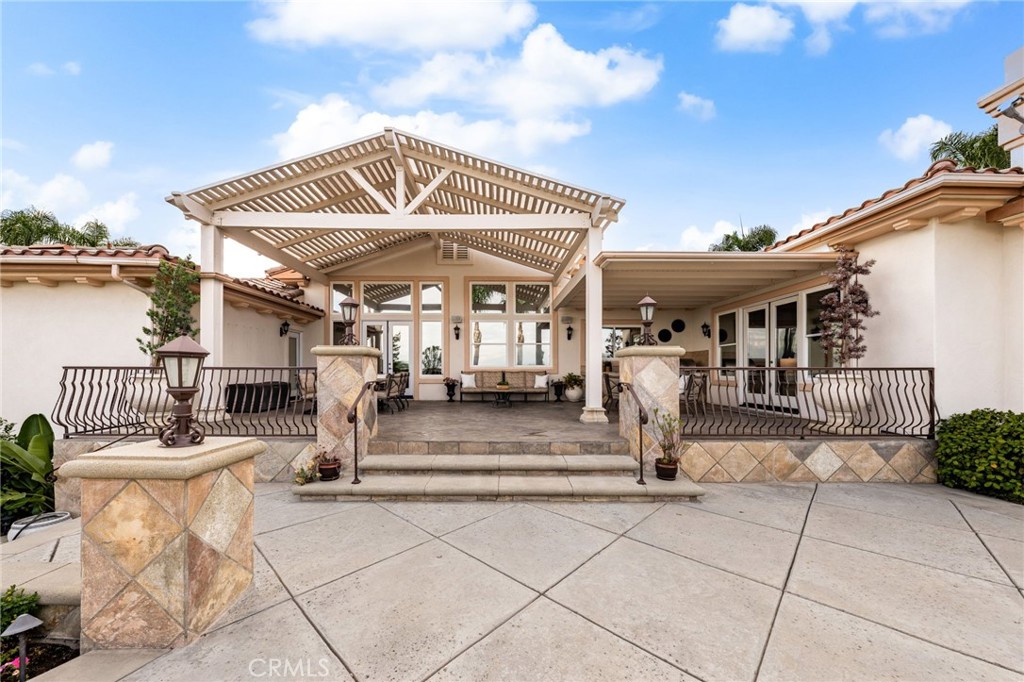 5501 Carriage Place Rancho Cucamonga, CA 91737 - Photo 46 of 60 a view of a house with sitting area and garden