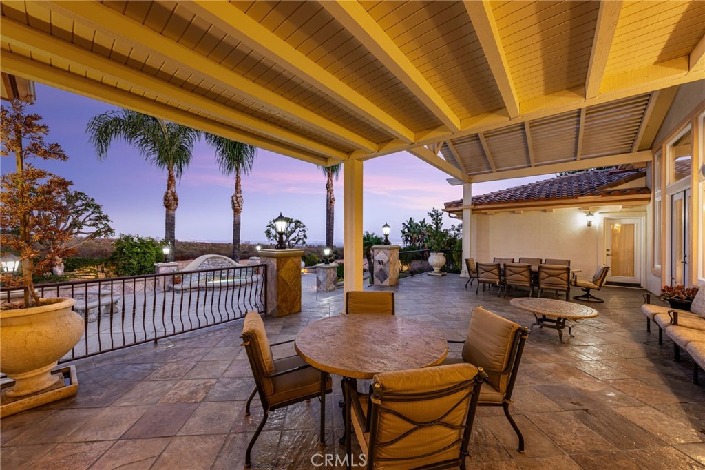 5501 Carriage Place Rancho Cucamonga, CA 91737 - Photo 48 of 60 a view of a patio with a table and chairs