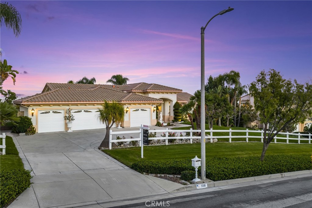 5501 Carriage Place Rancho Cucamonga, CA 91737 - Photo 55 of 60 a view of a house with a yard