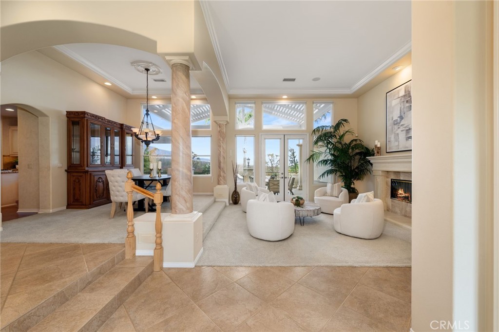 5501 Carriage Place Rancho Cucamonga, CA 91737 - Photo 7 of 60 a room with lots of white furniture and windows