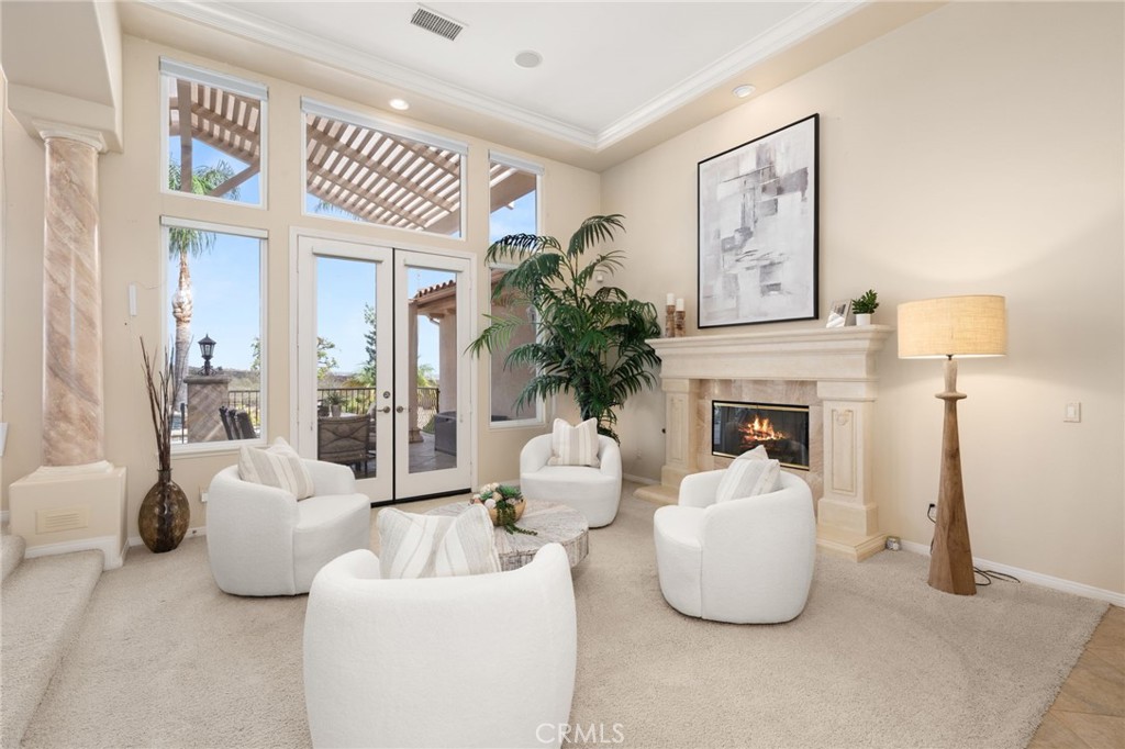 5501 Carriage Place Rancho Cucamonga, CA 91737 - Photo 9 of 60 a living room with furniture and a fireplace