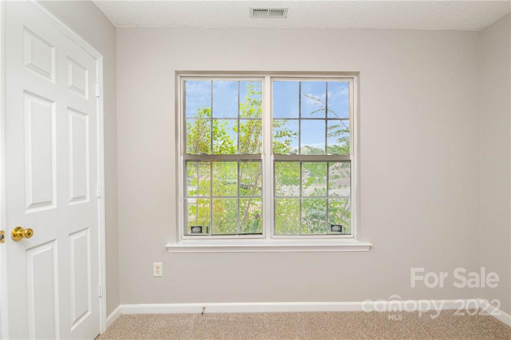 2800 Oneida Road Charlotte, NC 28269 - Photo 12 of 18 a view of an empty room with a window