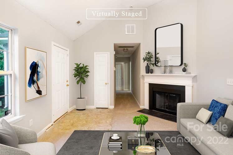 2800 Oneida Road Charlotte, NC 28269 - Photo 2 of 18 a living room with furniture and a fireplace