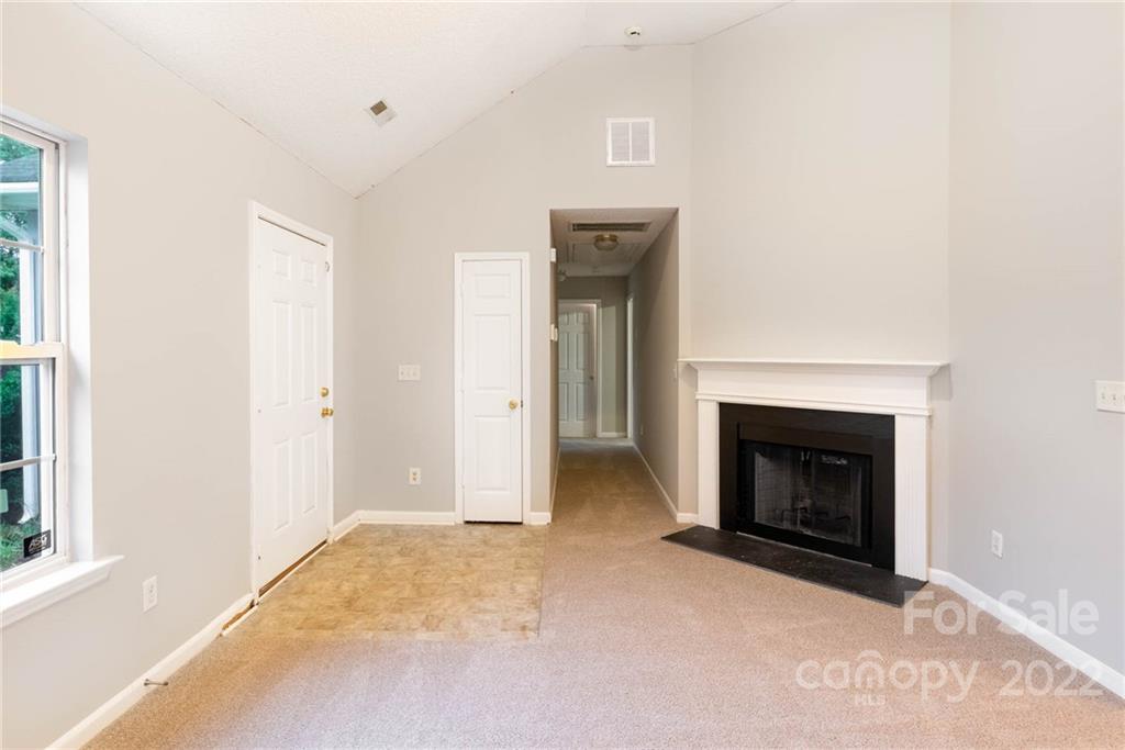 2800 Oneida Road Charlotte, NC 28269 - Photo 3 of 18 a view of an empty room with window and a fireplace