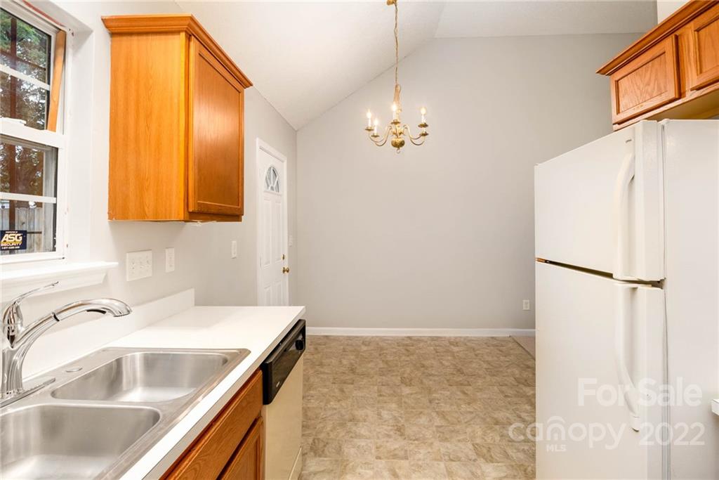 2800 Oneida Road Charlotte, NC 28269 - Photo 6 of 18 a bathroom with a sink and a refrigerator