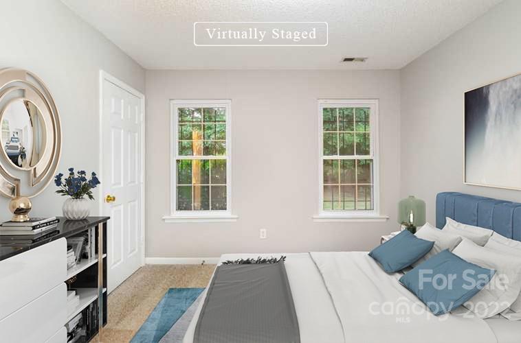 2800 Oneida Road Charlotte, NC 28269 - Photo 8 of 18 a bedroom with a bed and a window