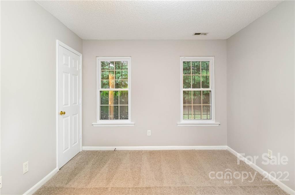 2800 Oneida Road Charlotte, NC 28269 - Photo 9 of 18 an empty room with windows