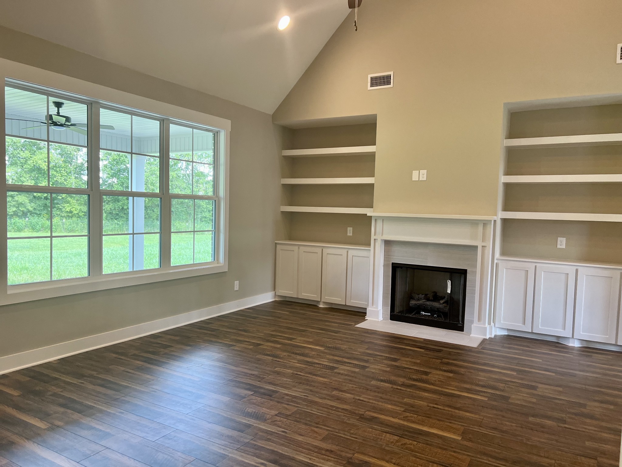 1442 Millstone Creek Road Lascassas, TN 37085 - Photo 11 of 30 a view of an empty room with wooden floor window and fire place