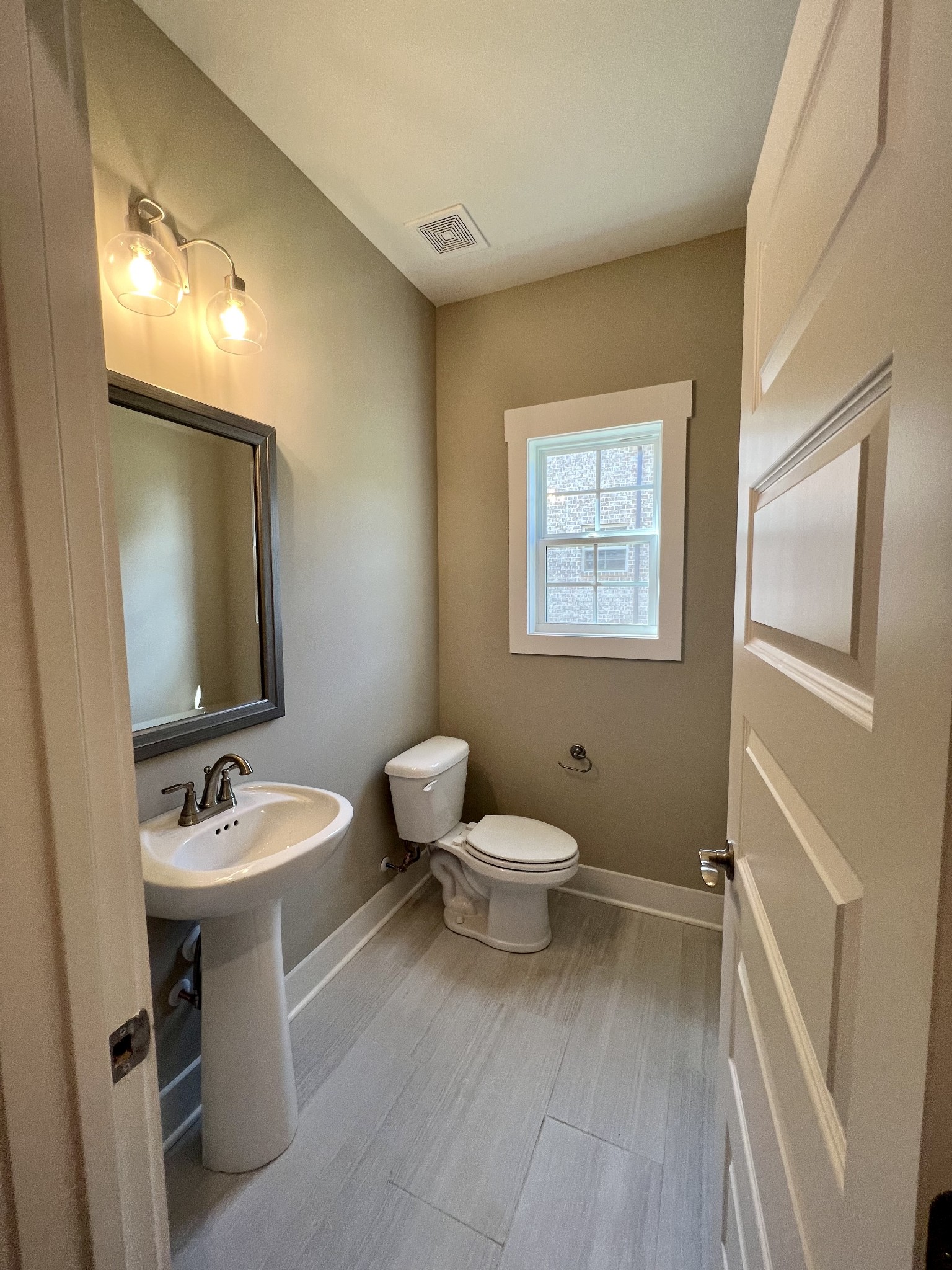 1442 Millstone Creek Road Lascassas, TN 37085 - Photo 17 of 30 a bathroom with a toilet sink and mirror
