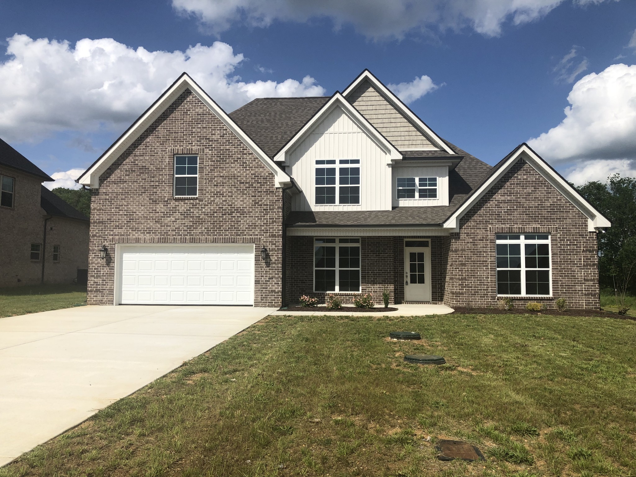 1442 Millstone Creek Road Lascassas, TN 37085 - Photo 2 of 30 a front view of a house with a yard