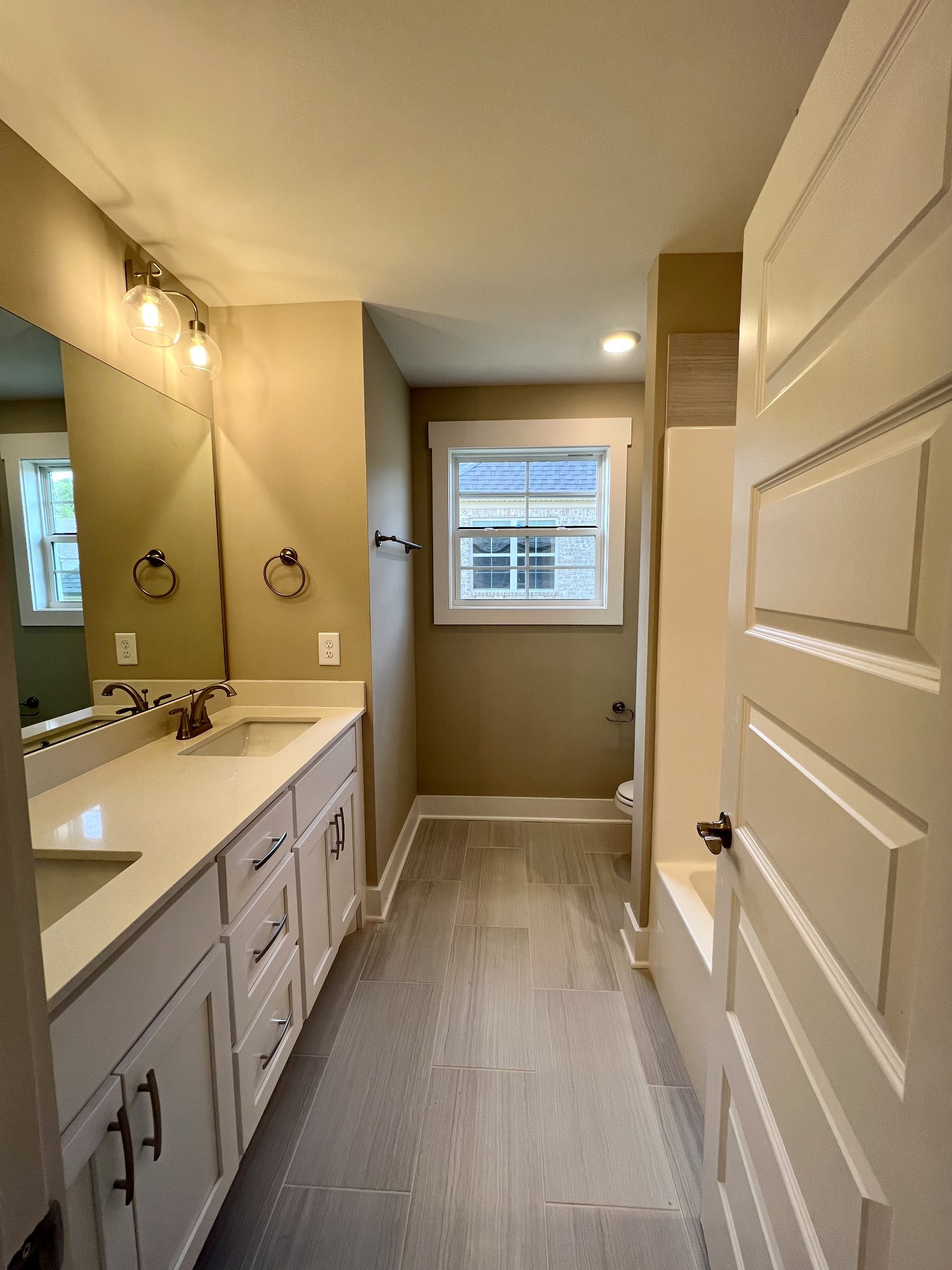 1442 Millstone Creek Road Lascassas, TN 37085 - Photo 26 of 30 a spacious bathroom with a double vanity sink a large mirror and shower