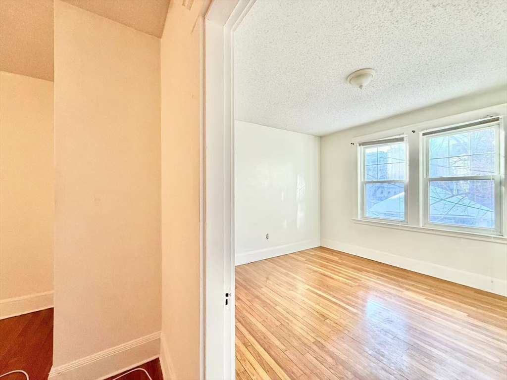 26 Chiswick Road, Unit 6 Boston, MA 02135 - Photo 9 of 19 a view of an empty room and window