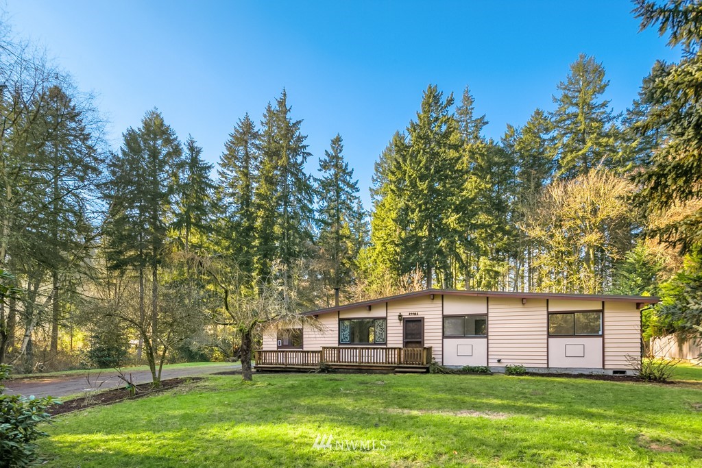 17721 Beall Road Southwest Vashon, WA 98070 - Photo 1 of 35 a front view of house with yard and green space