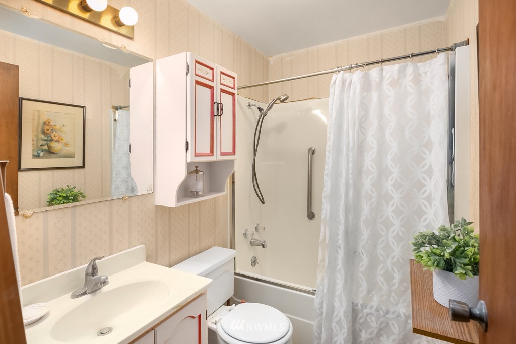 17721 Beall Road Southwest Vashon, WA 98070 - Photo 17 of 35 a bathroom with a sink toilet and shower