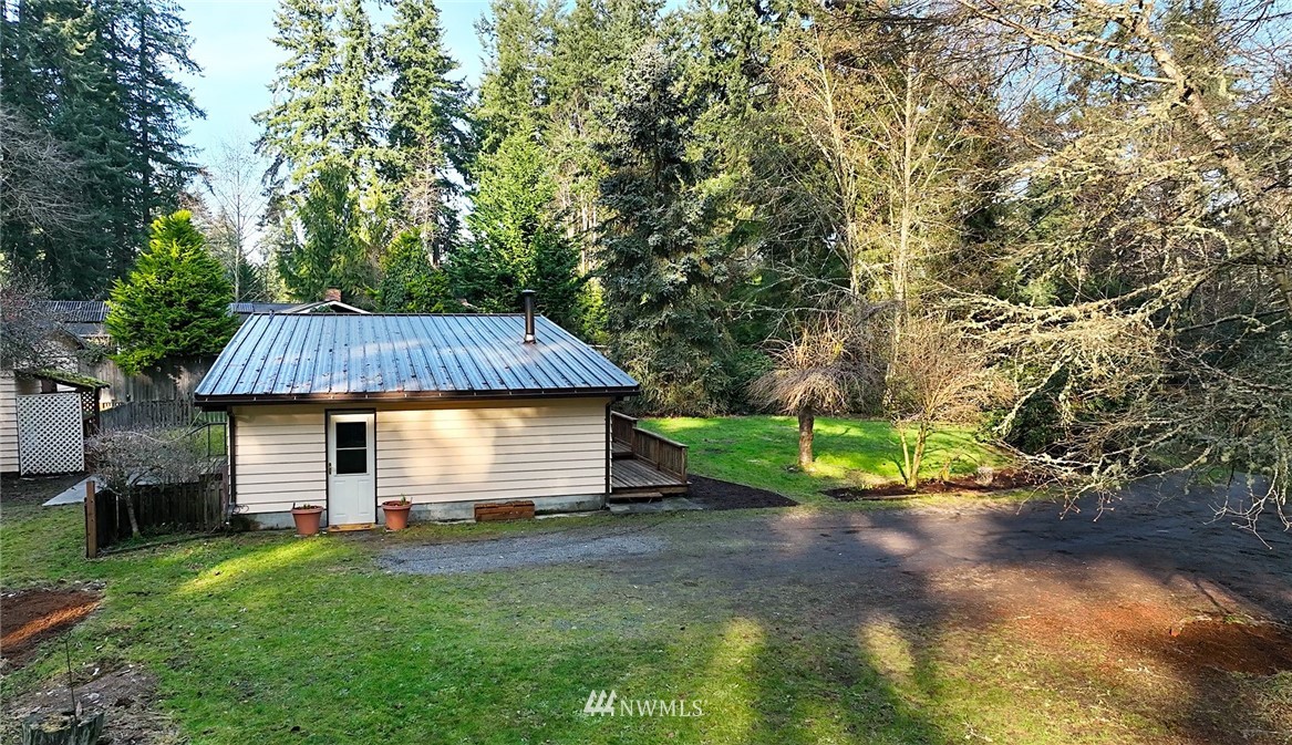 17721 Beall Road Southwest Vashon, WA 98070 - Photo 23 of 35 a view of backyard with small cabin