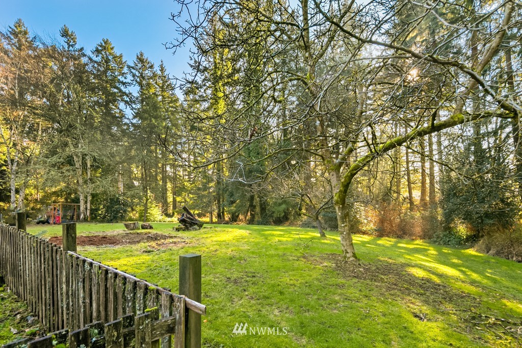 17721 Beall Road Southwest Vashon, WA 98070 - Photo 30 of 35 a view of yard with swimming pool and trees