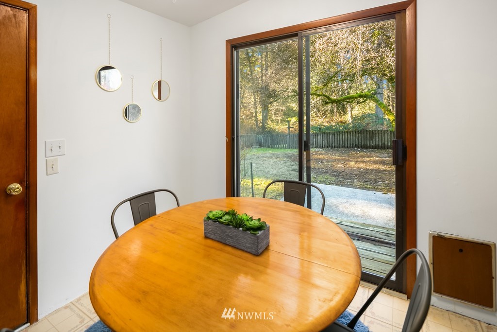 17721 Beall Road Southwest Vashon, WA 98070 - Photo 8 of 35 a view of a dining room with a table and chairs