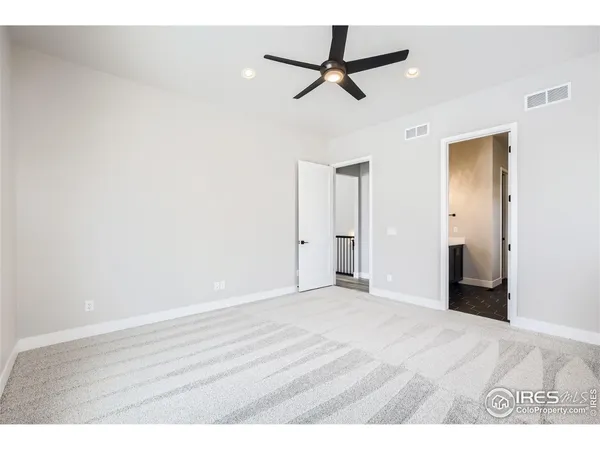 a bathroom with a white bath tub sitting next to a white sink and vanity