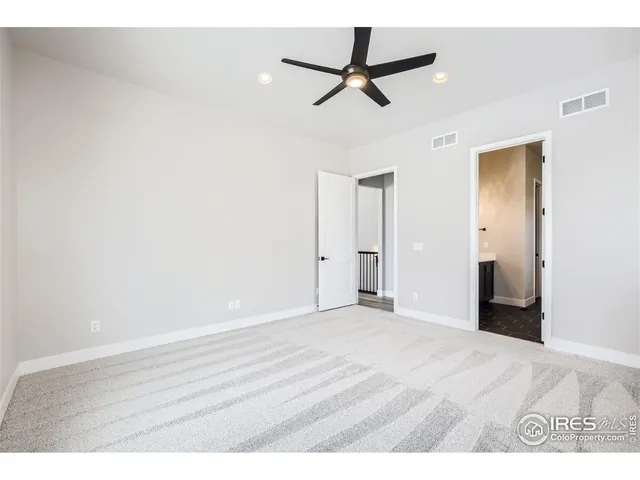 a bathroom with a white bath tub sitting next to a white sink and vanity