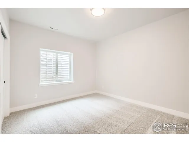 a living room with a bed and furniture