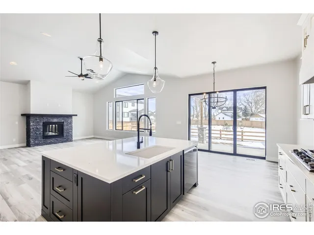 a kitchen with refrigerator cabinets and a sink
