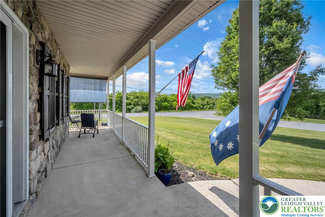 204 Bushkill Ridge Road Wind Gap, PA 18091 - Photo 41 of 48 A welcoming covered front porch, perfect for enjoying scenic views and tranquil moments.