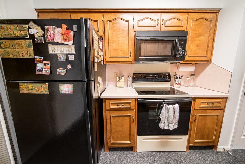6101 River Road, Unit 42 Columbus, GA 31904 - Photo 11 of 28 a kitchen with stainless steel appliances granite countertop a stove and cabinets