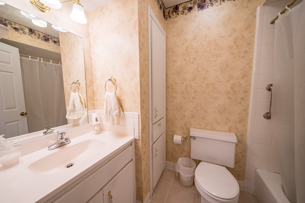 6101 River Road, Unit 42 Columbus, GA 31904 - Photo 18 of 28 a bathroom with a sink a toilet and shower