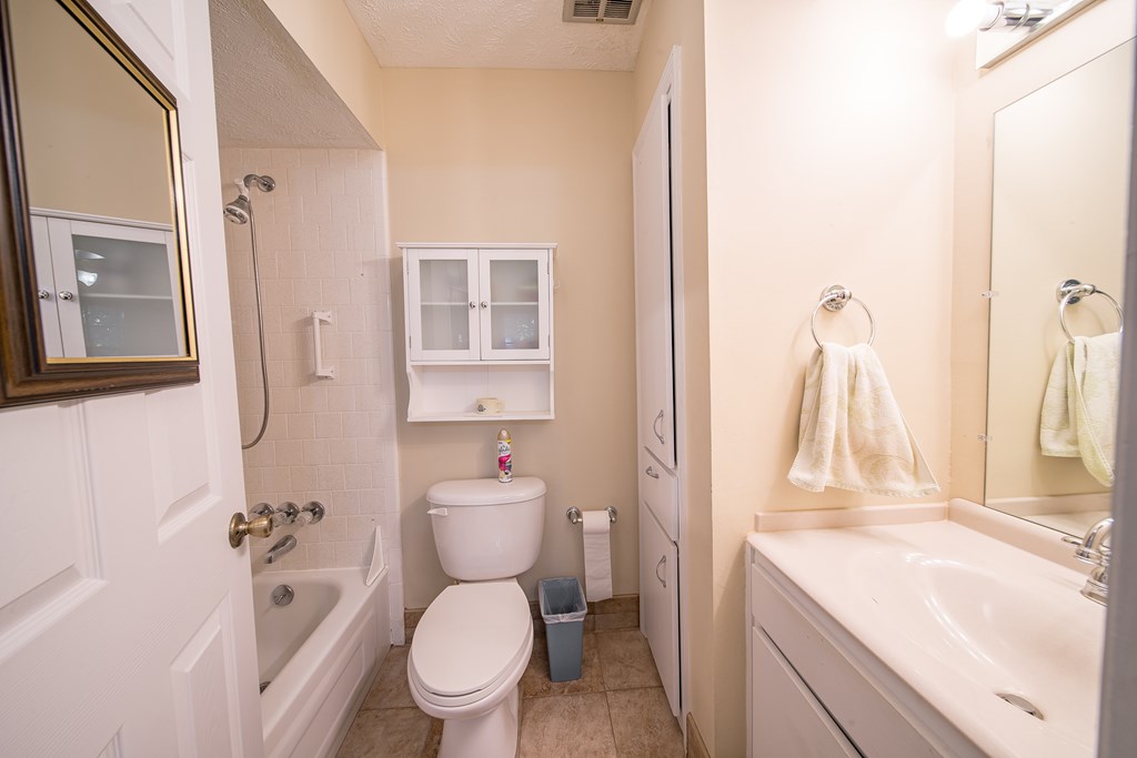 6101 River Road, Unit 42 Columbus, GA 31904 - Photo 21 of 28 a white toilet sitting next to a bathroom sink