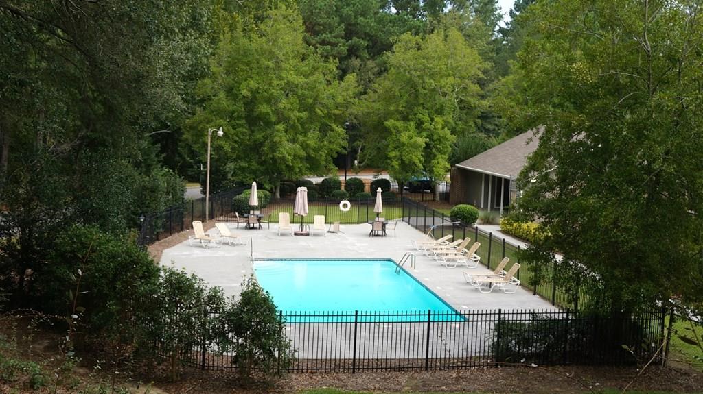 6101 River Road, Unit 42 Columbus, GA 31904 - Photo 26 of 28 a view of house with backyard outdoor seating and green space