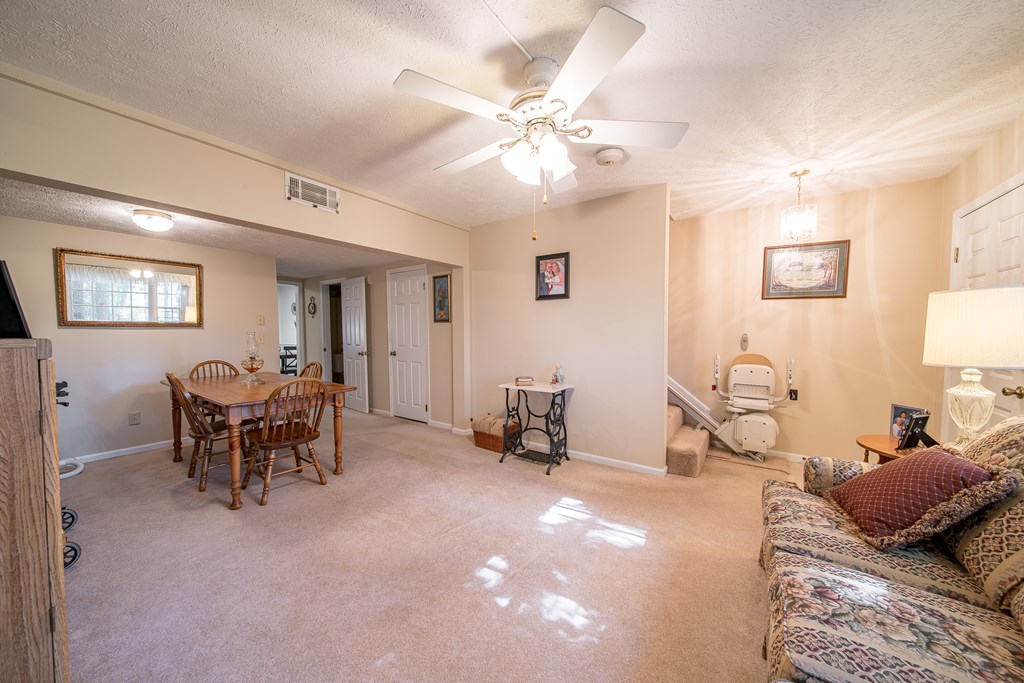 6101 River Road, Unit 42 Columbus, GA 31904 - Photo 5 of 28 a living room with furniture and a chandelier