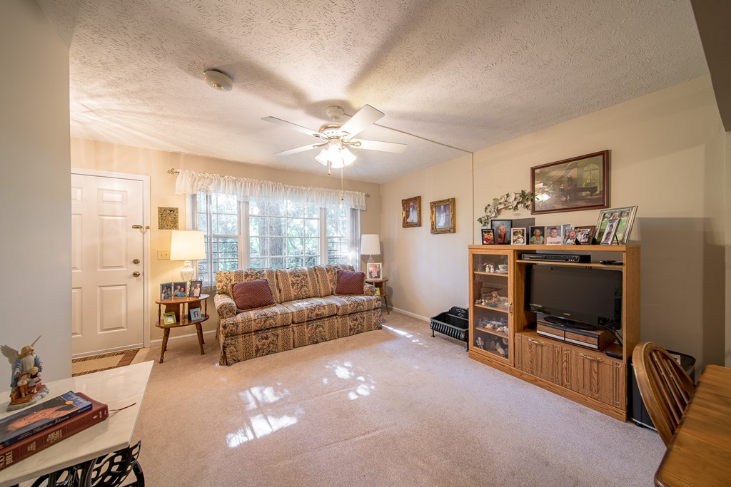 6101 River Road, Unit 42 Columbus, GA 31904 - Photo 6 of 28 a living room with furniture and a flat screen tv