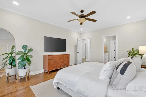a bathroom with a tub a rug and a shower
