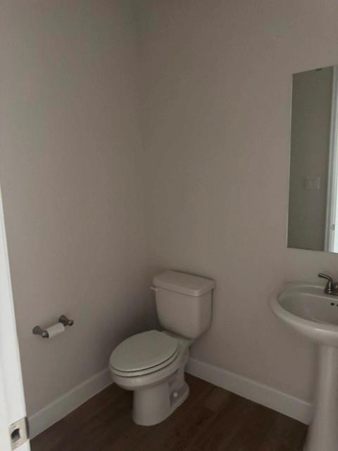 1917 Halkin Road Celina, TX 75009 - Photo 10 of 24 a white toilet sitting next to a bathroom sink